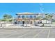 Beautiful building exterior with arches and balconies, enhanced by lush greenery and a spacious parking area at 6015 Catalina Dr. # 733, North Myrtle Beach, SC 29582