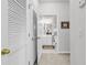 Hallway leading to a well-lit bathroom with a vanity and a shower/tub combination at 6015 Catalina Dr. # 733, North Myrtle Beach, SC 29582