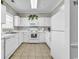 Bright kitchen with white cabinets, appliances, and tile flooring at 6015 Catalina Dr. # 733, North Myrtle Beach, SC 29582