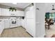 Well-lit kitchen with appliances, tile floors and seamless pass through to living area at 6015 Catalina Dr. # 733, North Myrtle Beach, SC 29582