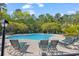 A resort-style pool area showcasing the inviting pool and comfortable lounge seating at 6015 Catalina Dr. # 733, North Myrtle Beach, SC 29582