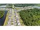 Aerial view of a neighborhood showcasing well-maintained homes, lush greenery, and community ponds at 625 Heritage Downs Dr., Conway, SC 29526