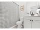Well lit bathroom features a vanity and a shower/tub with stylish striped curtain at 625 Heritage Downs Dr., Conway, SC 29526