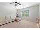Relaxing living room featuring a sectional sofa, ceiling fan, window, and neutral carpet at 625 Heritage Downs Dr., Conway, SC 29526