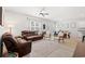 Open-concept living room with modern furniture and decor, seamlessly connected to the dining area at 625 Heritage Downs Dr., Conway, SC 29526