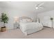 Bright main bedroom featuring neutral decor, plush carpet, and a ceiling fan at 625 Heritage Downs Dr., Conway, SC 29526