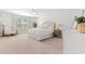 Bright main bedroom featuring neutral decor, plush carpet, a ceiling fan, and a window with natural light at 625 Heritage Downs Dr., Conway, SC 29526
