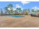 Community pool with zero entry and water features, surrounded by trees for a relaxing atmosphere at 625 Heritage Downs Dr., Conway, SC 29526