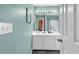 Bathroom area showcasing vanity with sink and faucet, mirror, and toilet with shower curtain at 701 Wilshire Ln. # 0, Murrells Inlet, SC 29576