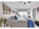 Bedroom includes a large bed, modern white nightstand, shelf, and decorative wall art at 701 Wilshire Ln. # 0, Murrells Inlet, SC 29576