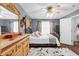 Elegant bedroom with decorative dresser, large windows, and comfortable bed at 701 Wilshire Ln. # 0, Murrells Inlet, SC 29576