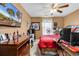 Bedroom featuring a ceiling fan, flat-screen TV, window, desk, bed, and closet at 701 Wilshire Ln. # 0, Murrells Inlet, SC 29576