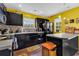 Bright eat-in kitchen with black appliances, yellow walls, and a butcher block island at 701 Wilshire Ln. # 0, Murrells Inlet, SC 29576