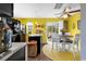 Eat-in kitchen featuring bright yellow walls and modern black appliances at 701 Wilshire Ln. # 0, Murrells Inlet, SC 29576