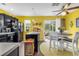 Bright eat-in kitchen with black appliances, black cabinets, and a casual dining area at 701 Wilshire Ln. # 0, Murrells Inlet, SC 29576