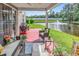 Covered patio with outdoor seating overlooking a serene pond with fountain at 701 Wilshire Ln. # 0, Murrells Inlet, SC 29576