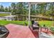 Relaxing patio view overlooking a serene pond with a fountain and lush greenery at 701 Wilshire Ln. # 0, Murrells Inlet, SC 29576