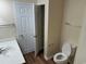 Bright bathroom with white cabinets, a toilet and a separate storage closet at 753 Bucklin Loop, Myrtle Beach, SC 29579