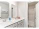 Modern bathroom featuring double sinks, white countertops, and view into shower/toilet room at 768 Choctaw Dr., Conway, SC 29526