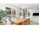 Bright dining area with a view of the pool, featuring a wooden table and stylish seating at 768 Choctaw Dr., Conway, SC 29526
