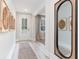 Inviting entryway featuring light wood floors and stylish decor, with a view of the front door at 768 Choctaw Dr., Conway, SC 29526