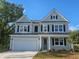Charming two-story home with light blue siding, black shutters, and a well-maintained lawn at 768 Choctaw Dr., Conway, SC 29526