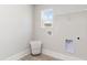 Clean laundry room with washer hookup, shelf, and ample space for storage at 768 Choctaw Dr., Conway, SC 29526