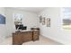 Bright office with a large desk, natural light, and view of landscaped surroundings at 768 Choctaw Dr., Conway, SC 29526