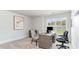 Bright office space with a large window, desk, and comfortable seating, and an outdoor view at 768 Choctaw Dr., Conway, SC 29526