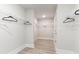 Spacious walk-in closet with wire shelving for ample storage and light wood-look flooring at 768 Choctaw Dr., Conway, SC 29526