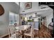 Dining area with luxury vinyl plank flooring, adjacent to the kitchen and staircase at 806 N Waccamaw Dr. # 304, Garden City Beach, SC 29576