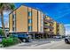 Coastal condo building featuring raised parking and private balconies with direct beach access at 806 N Waccamaw Dr. # 304, Garden City Beach, SC 29576