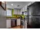 Updated kitchen with modern stainless steel appliances and crisp white cabinetry at 806 N Waccamaw Dr. # 304, Garden City Beach, SC 29576