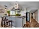 Cozy kitchen featuring a breakfast bar with adjacent access to the dining area at 806 N Waccamaw Dr. # 304, Garden City Beach, SC 29576