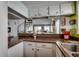 Breakfast bar featuring an open view into the living room and spiral staircase at 806 N Waccamaw Dr. # 304, Garden City Beach, SC 29576