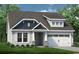 Charming single-Gathering home featuring a two-car garage, stone accents, and a well-manicured lawn at 811 Big Cedar Dr., Loris, SC 29569