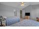 Bright bedroom featuring two beds, ceiling fan, and a TV for relaxing, comfortable living at 816 Barn Owl Ct. # 816, Myrtle Beach, SC 29579