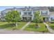 Inviting townhome with blue shutters, green lawn, mature trees, and a welcoming front yard at 816 Barn Owl Ct. # 816, Myrtle Beach, SC 29579