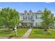 Charming two-story townhome with blue shutters, lush landscaping, and a well-manicured lawn at 816 Barn Owl Ct. # 816, Myrtle Beach, SC 29579