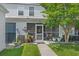 Charming home exterior featuring a screened porch, beautiful landscaping, and a well-maintained yard at 816 Barn Owl Ct. # 816, Myrtle Beach, SC 29579