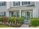 Inviting covered front porch with lush greenery and charming curb appeal at 816 Barn Owl Ct. # 816, Myrtle Beach, SC 29579