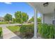 Covered front porch with neat landscaping, offering a pleasant view of the neighborhood at 816 Barn Owl Ct. # 816, Myrtle Beach, SC 29579
