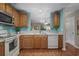 Well-lit kitchen with light wood cabinets, appliances, and an open view to the living room at 816 Barn Owl Ct. # 816, Myrtle Beach, SC 29579