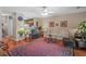 Open-concept living room featuring hardwood floors, area rug, stylish seating, and an open view to the kitchen at 816 Barn Owl Ct. # 816, Myrtle Beach, SC 29579