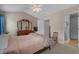 Bright main bedroom with a large dresser, comfortable seating, and an ensuite bathroom at 816 Barn Owl Ct. # 816, Myrtle Beach, SC 29579