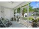 Relaxing screened porch with seating area, plants, and an open view of the yard and surroundings at 816 Barn Owl Ct. # 816, Myrtle Beach, SC 29579