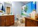 Comfortable bathroom with beach-themed curtain, vanity, and coordinated accessories, creating a refreshing and functional space at 8506 Old Nichols Hwy., Nichols, SC 29581