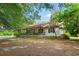 Charming single-story home featuring a welcoming front porch and lush landscaping at 8506 Old Nichols Hwy., Nichols, SC 29581