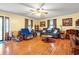 Inviting living room featuring hardwood floors, large windows, and cozy seating at 8506 Old Nichols Hwy., Nichols, SC 29581