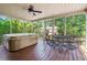 Relaxing screened porch featuring a hot tub and an outdoor seating area at 8506 Old Nichols Hwy., Nichols, SC 29581